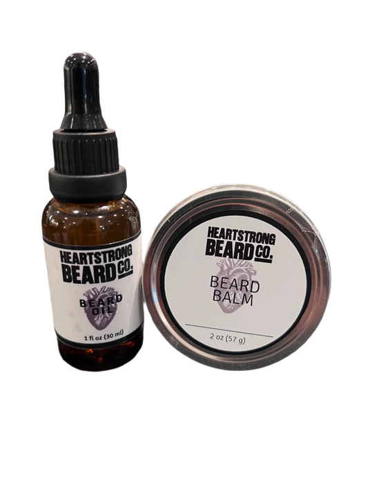 Heartstrong Beard Co. beard balm and oil on a textured surface with blurred background